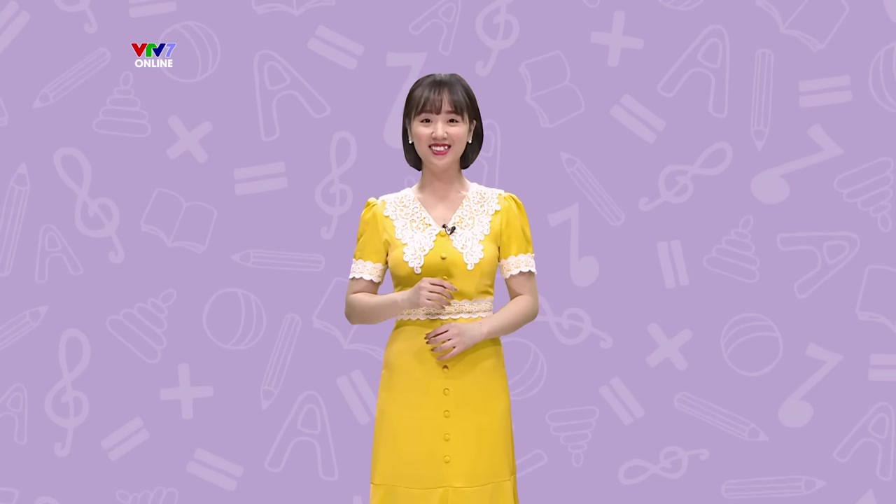 Cô giáo hướng dẫn viết dấu nặng dưới chữ "a", minh họa vị trí đặt dấu chính xác.